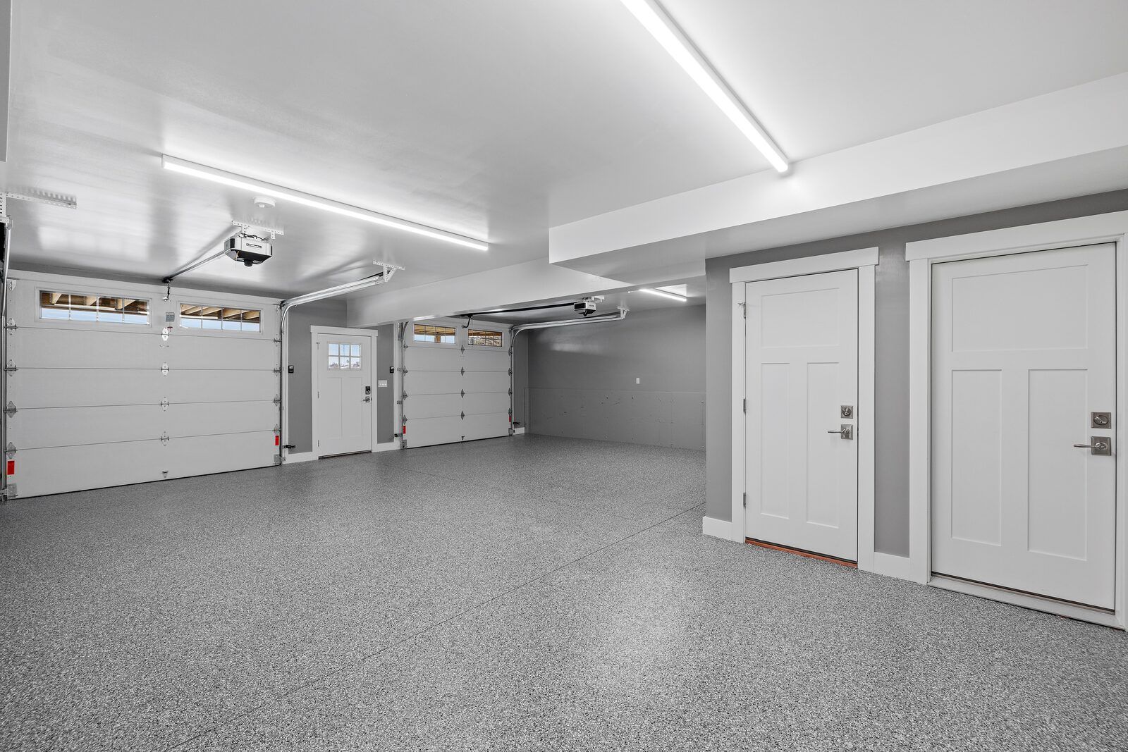 Full-broadcast flake floor in a bright modern garage