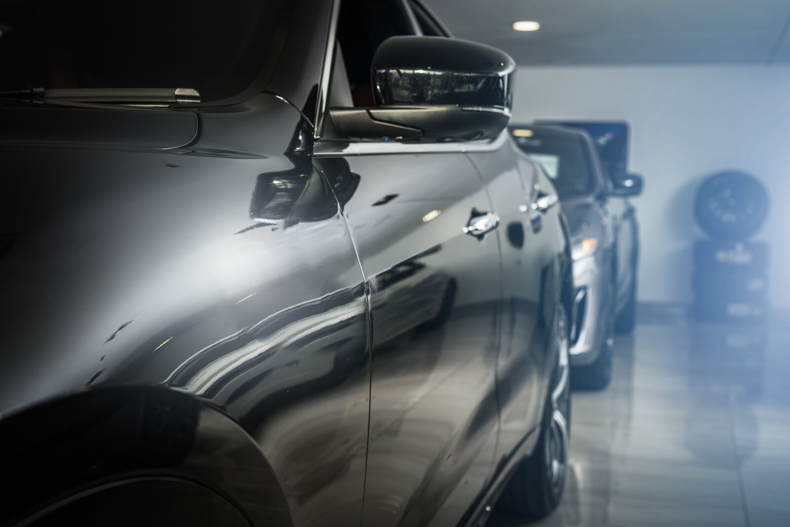 Glossy garage coating reflecting two cars